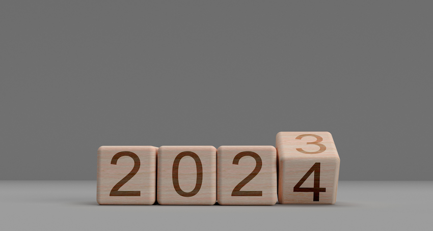 Image of wooden blocks with 2024 text  on the outside to represent Trends for 2024: What does the future of your Intranet look like? a lumapps hosted webinar about employee intranets
